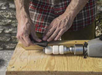 Sanding the barrel of a duck call