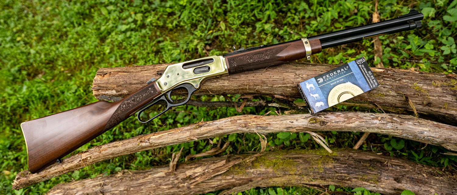 30-30 lever action rifle with ammo at a shooting range