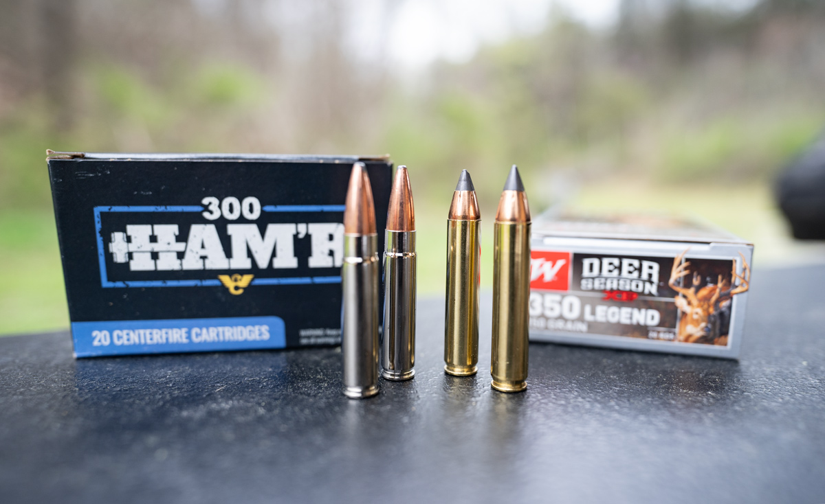 300 HAM'R ammo side by side with 350 legend ammo cartridges at a shooting range.
