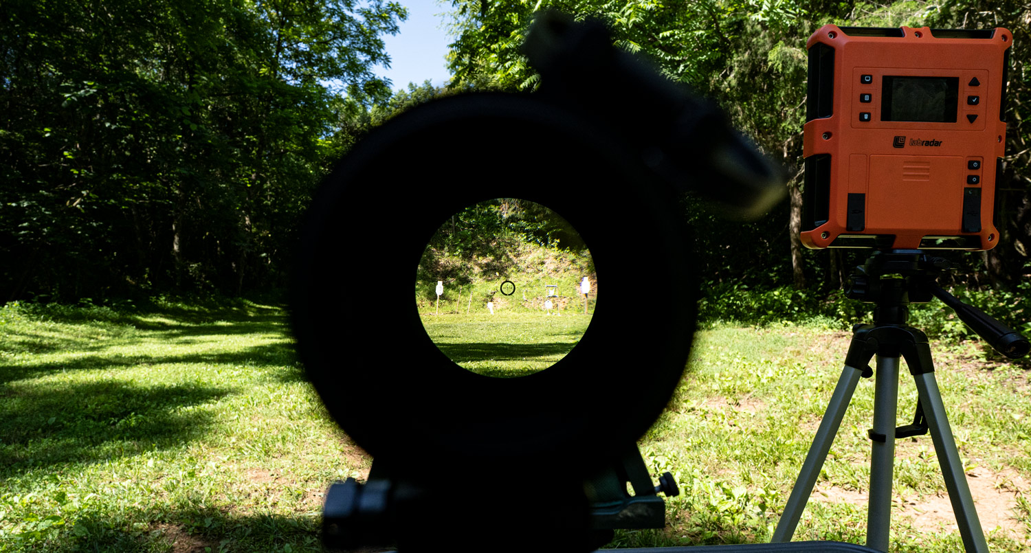 Looking through the scope of a 6.5 Grendel rifle downrange