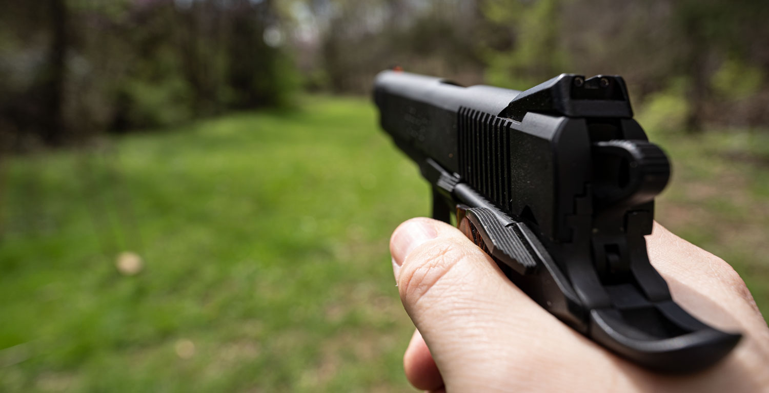 pointing a 45 auto pistol downrange