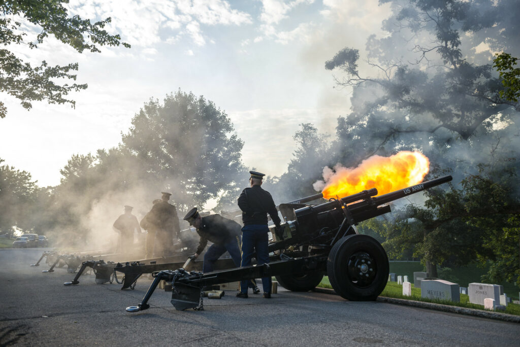 Cannons firing a 21 gun salute at the Arlington National Cemetery