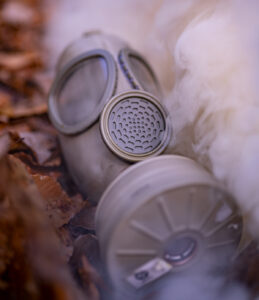 a surplus gas mask in a smoke cloud